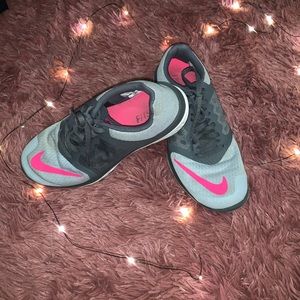 Pink and grey Nike running shoes